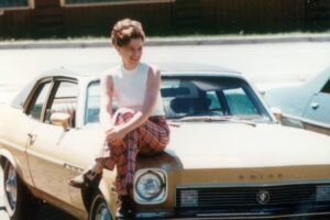 My Mom and her prized possession: her first car.