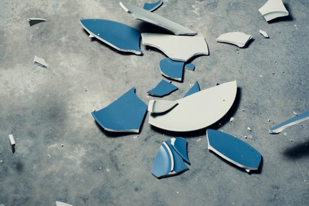 Failure broken blue plate on ground