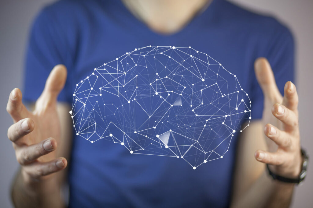 neuroscience - hands holding brain activity imagery