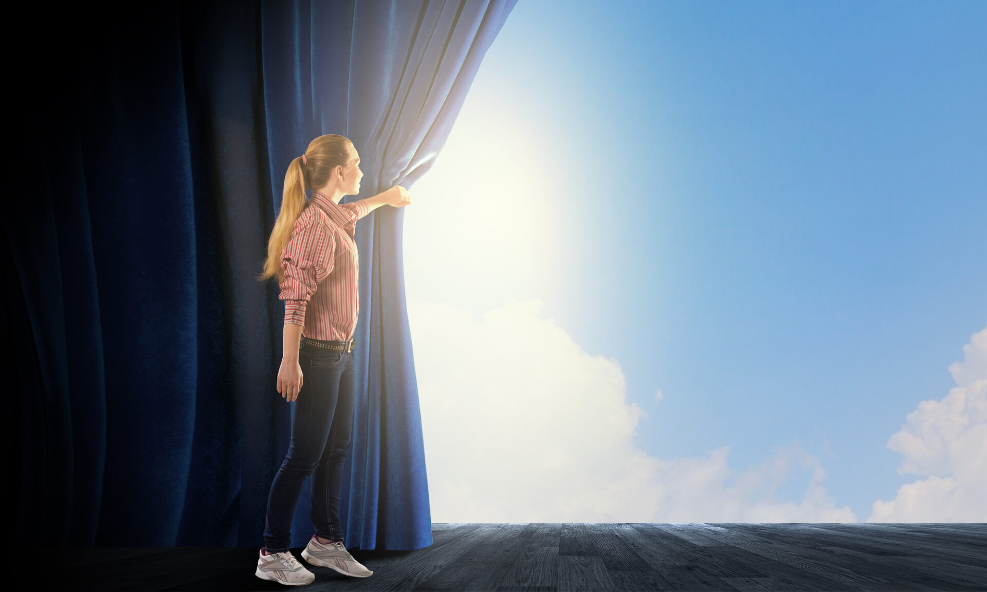 Life transitions - girl pulling back a curtain on a bright sky filled with clouds