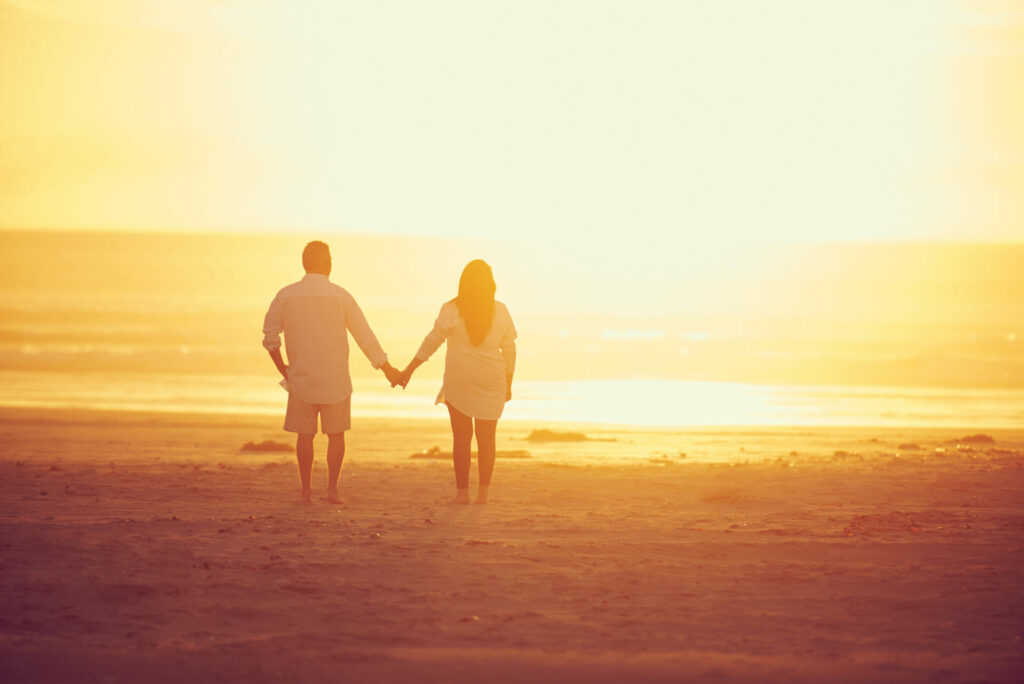 couple walking on the beach at sunset - relationship.jpg